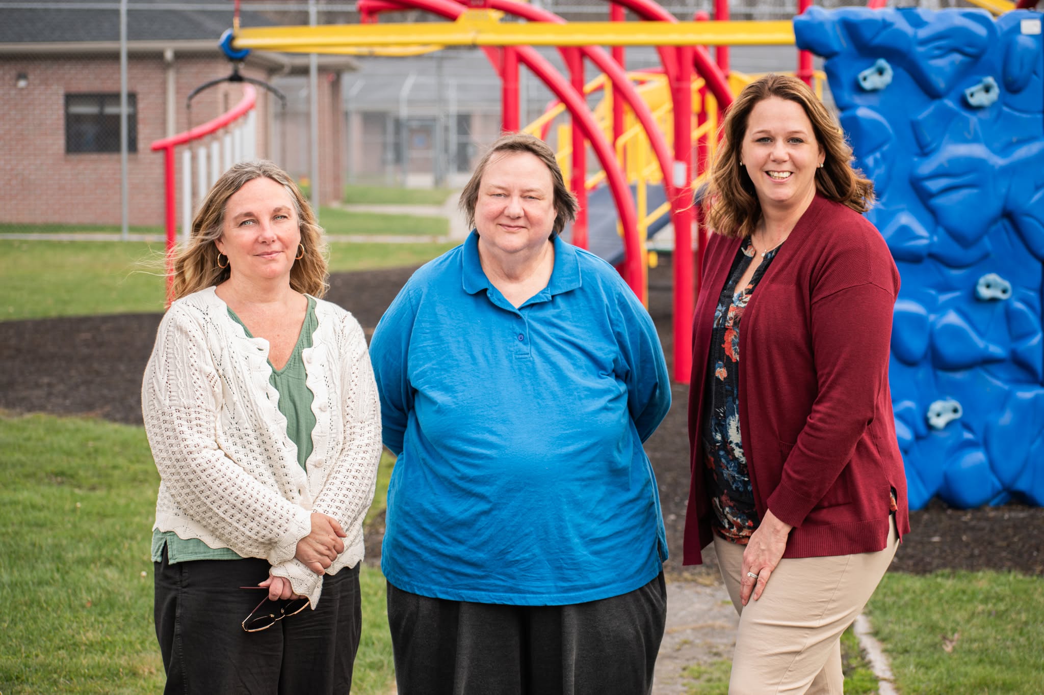 GJR staff members at campus playground