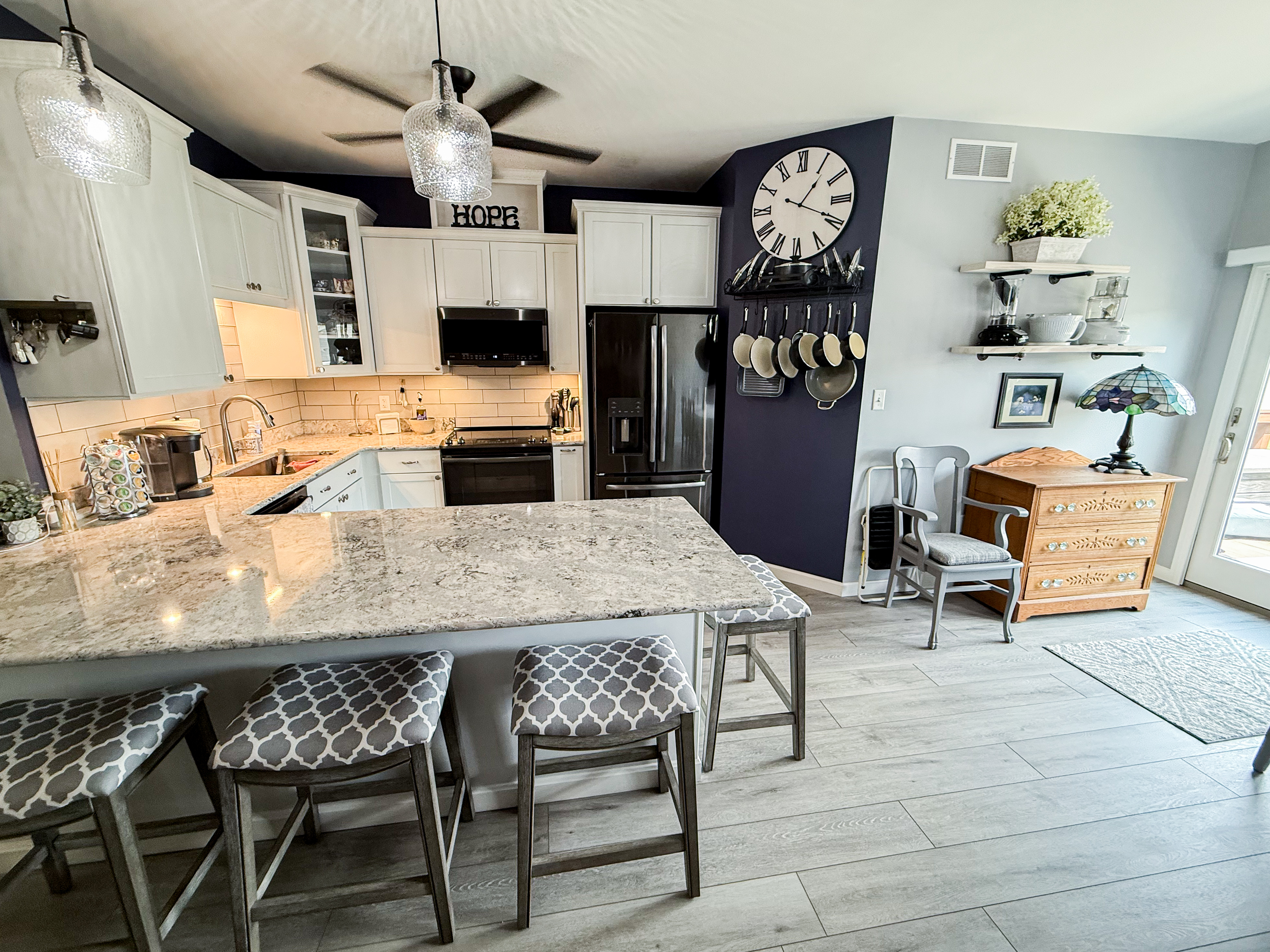 Open-concept kitchen with island, photographed for a listing