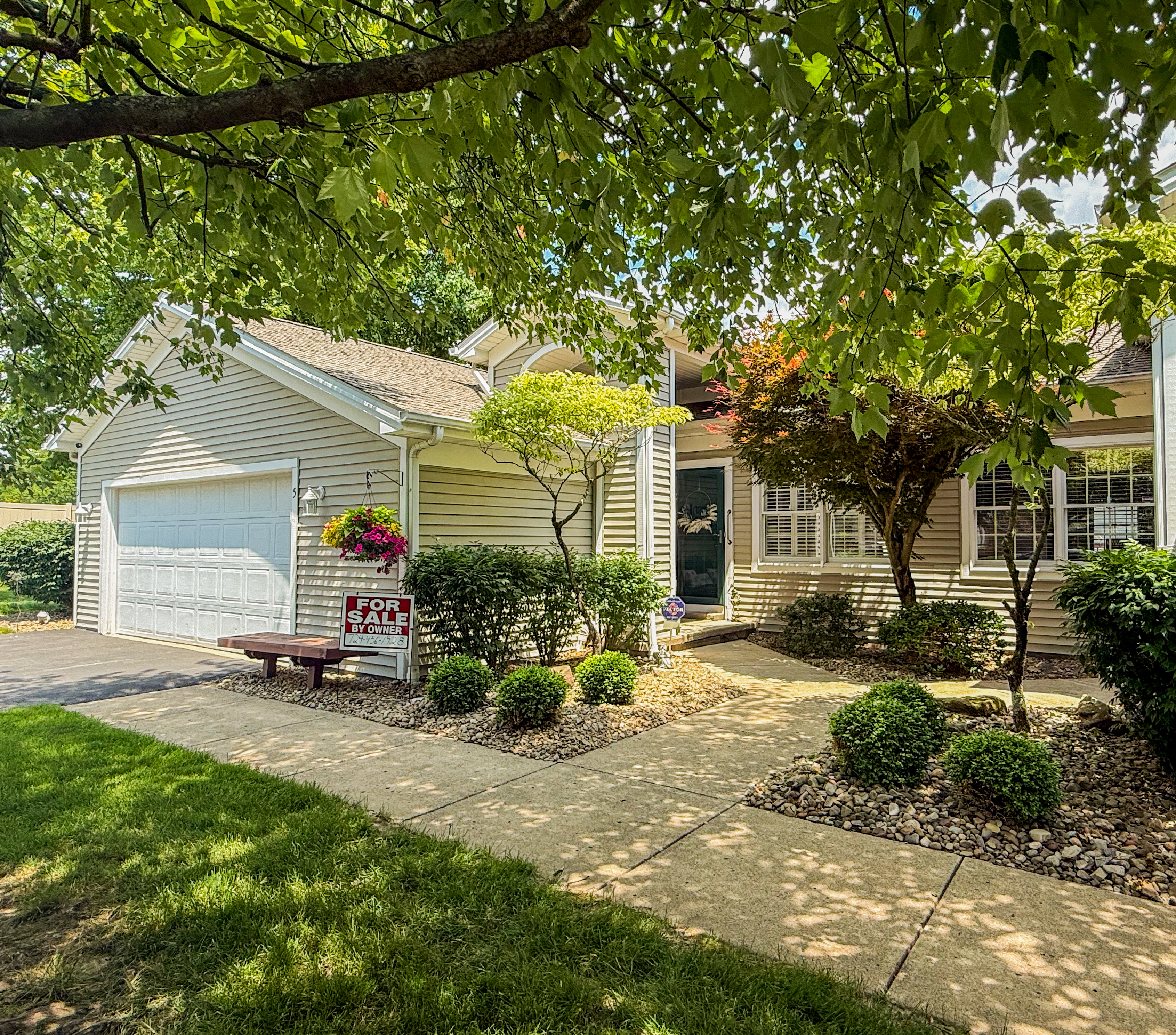For-sale-by-owner home exterior with curb appeal and FSBO sign
